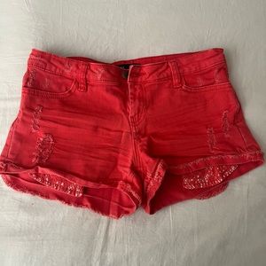 Coral jean shorts with lace pockets